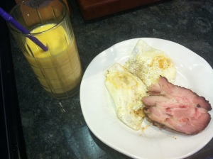 Random breakfast of smoked pork shoulder, two fried eggs, and homemade smoothie (orange, frozen mango and kefir).