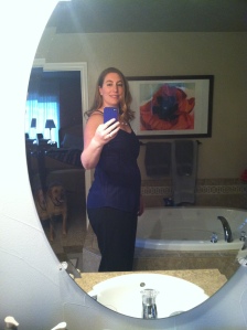 Me at 17w6d in a non-maternity shirt/shell and maternity work pants.